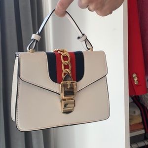 Blue white and red clutch